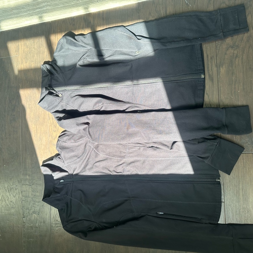 Black duo define zip ups